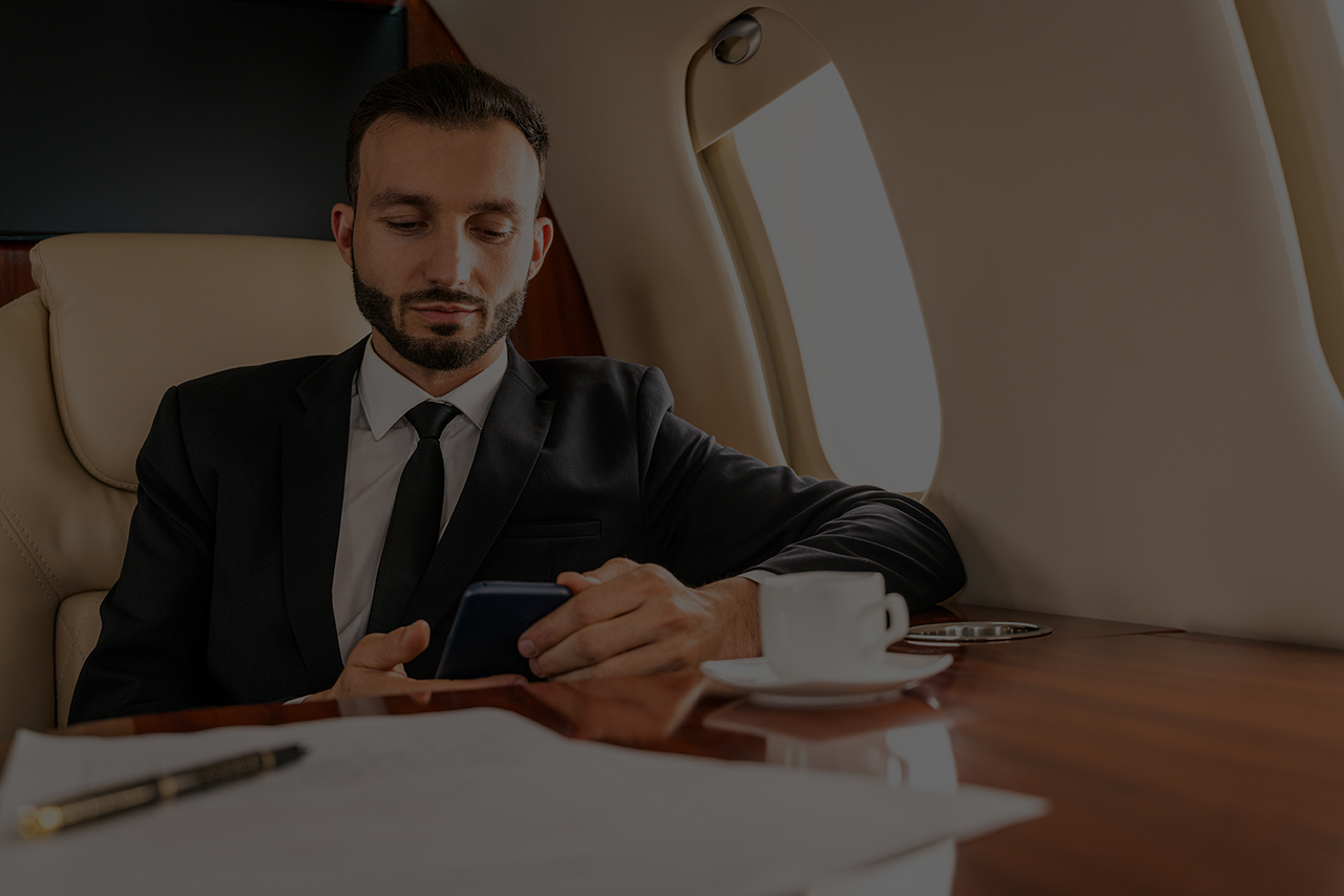 Businessman flying on private jet