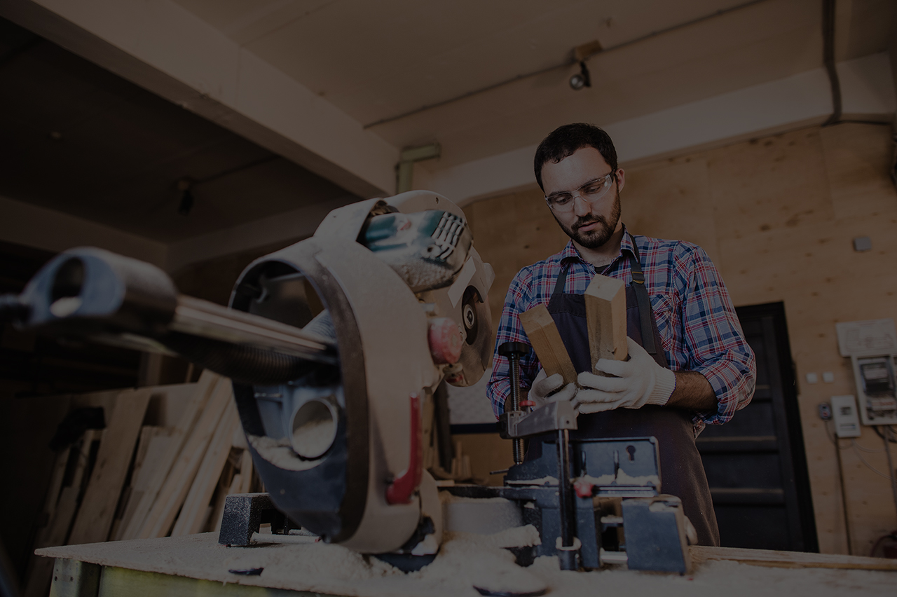 Framing contractor using a circular cut off saw to trim wood studs length.